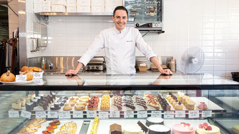 Yves Scherrer behind the pastry counter at Madame & Yves in Clovelly